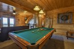 Terrace level game area with pool table and darts